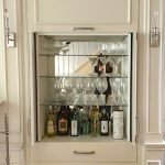 ROSEDALE CLIENT IS THRILLED WITH NEW CUSTOM BUILT IN CABINETS AND CONCEALED BAR