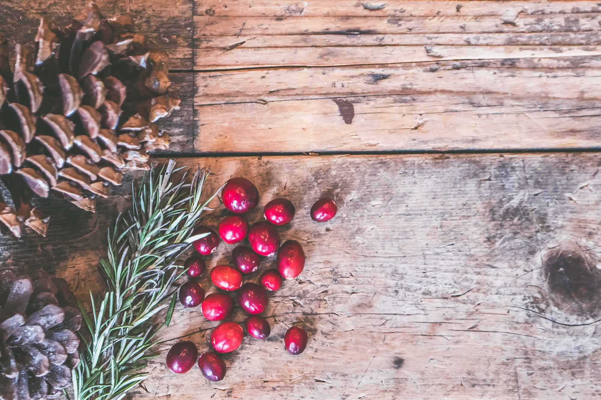 Design for Conscious Living - Go Green for the Holidays - Red fruits on Table - Photo by Jessica Lewis from Pexels